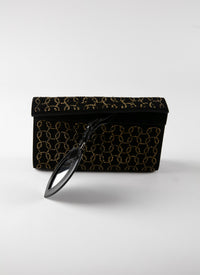 Studded motif clutch bag in leather - Black & Gold