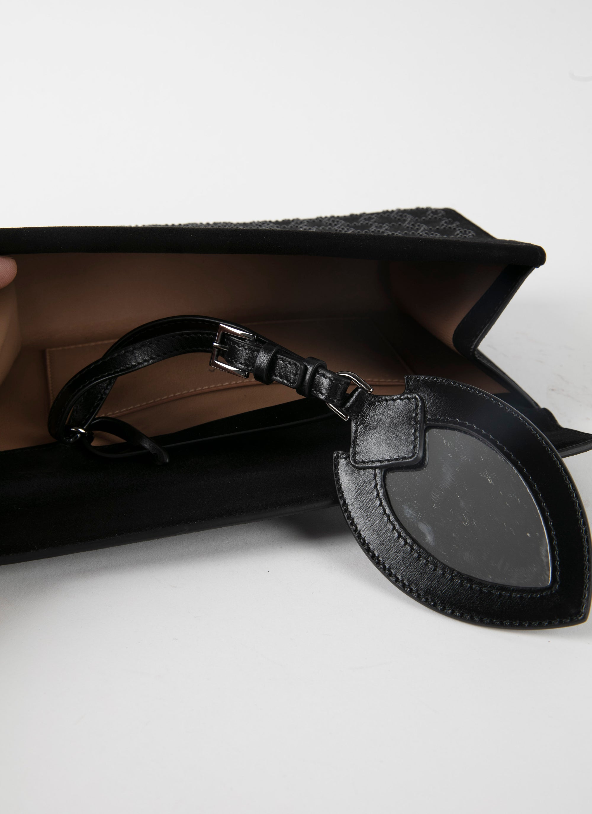 Studded motif clutch bag in leather - Black & Black